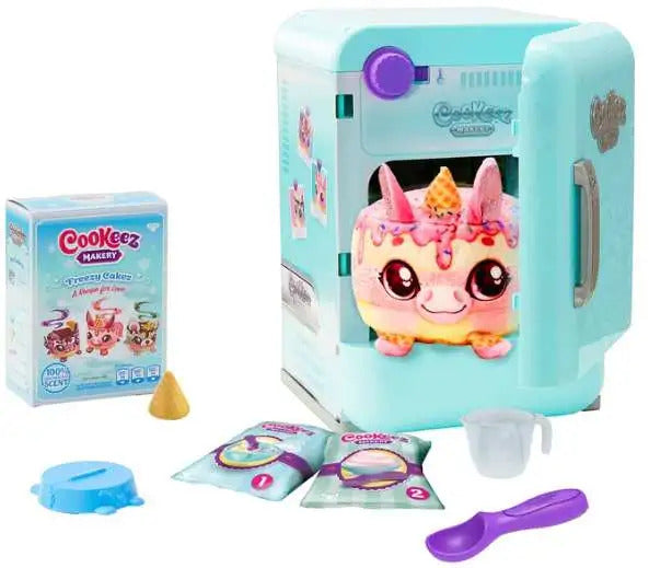 Toy kitchen set with a character inside, packaging, and accessories on a white background