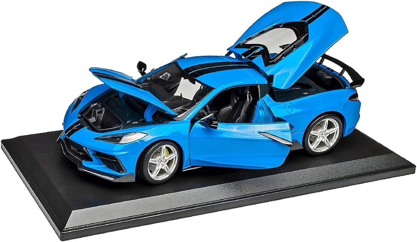 Blue sports car model on a black platform with open doors and hood.