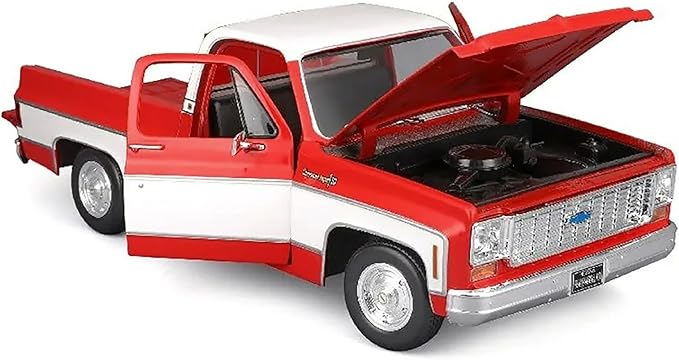 Model of a red and white truck with open hood on a white background