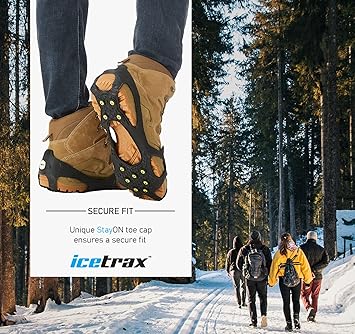 Person wearing ice traction shoes with a snowy forest background