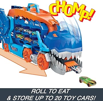 Toy dinosaur with a track and 'chomp!' text, featuring Hot Wheels cars.